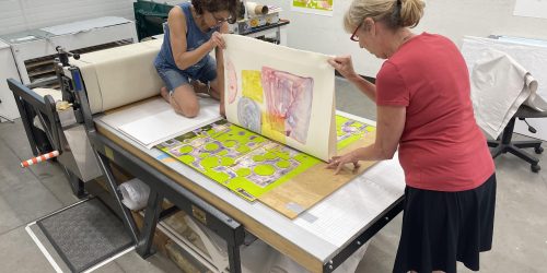 Sue Oehme with Catherine Shuman Miller (on press)